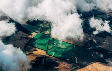 Ariel photo of wind turbines  by Thomas Richter on Unsplash